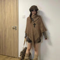 Women's casual plush design sweater shawl cape in triangle shape with tassel details, available in multiple colours.