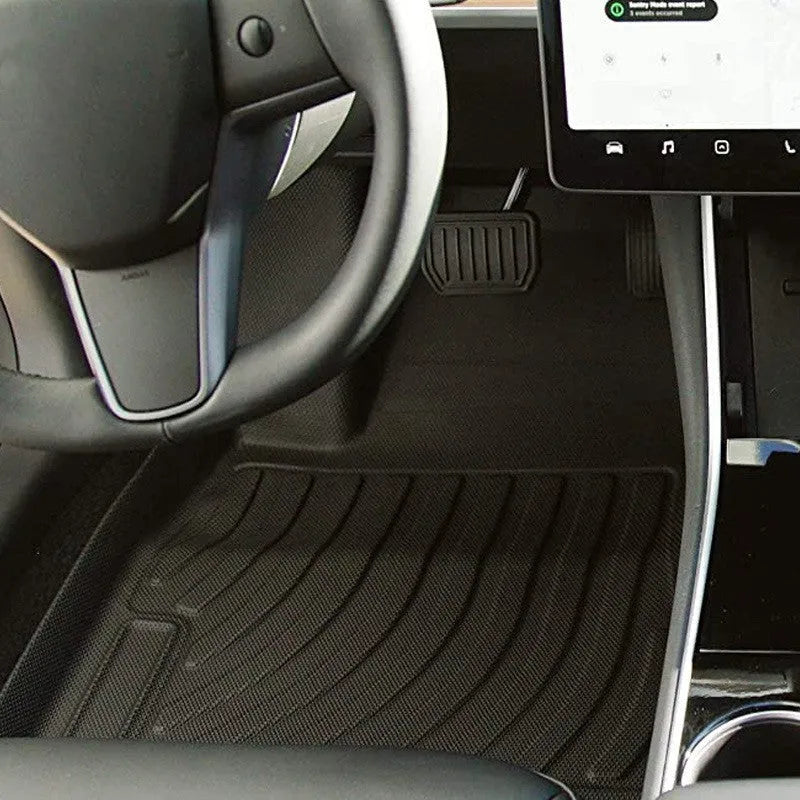 Rubber floor mats for Tesla cars with TPE footrest, custom-fit to Model 3, Y, S, X interiors, showing non-slip backing and textured surface