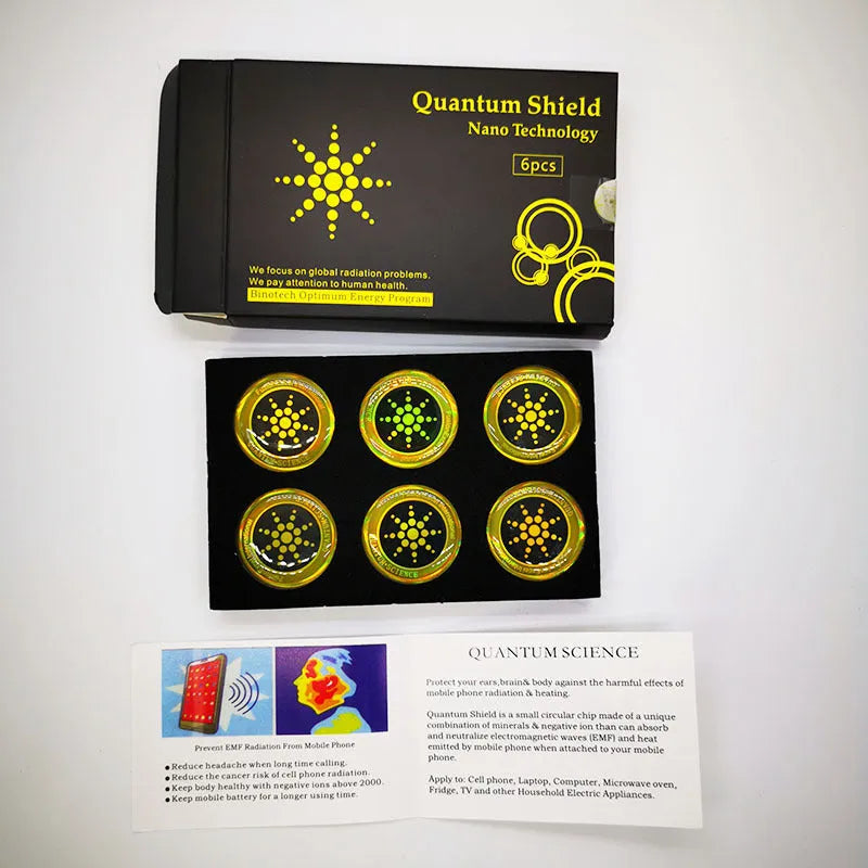 Six gold and silver anti-radiation phone stickers on backing sheet