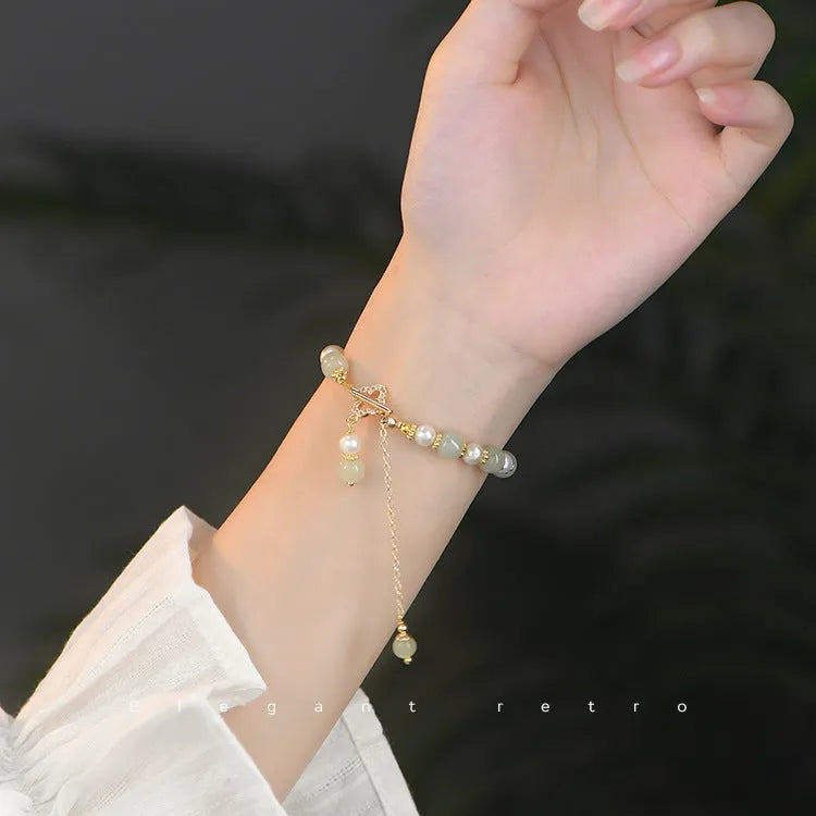 Women's Hetian jade bracelet with round pearl pendant in gold electroplated finish