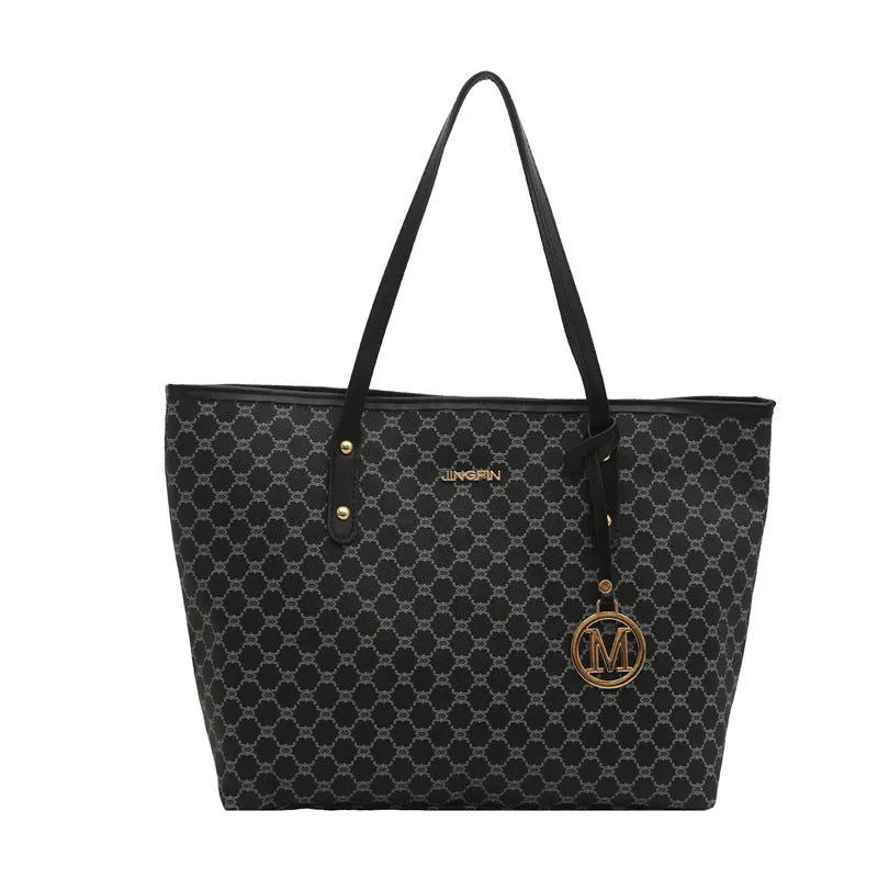 PU street style shoulder bag in black showing 42cm width and sewing thread detailing with polyester lining