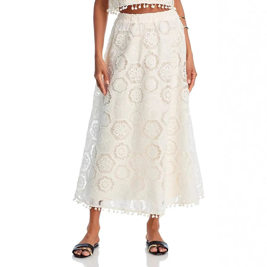 White women's suit with sleeveless top and long skirt featuring embroidery details in retro style