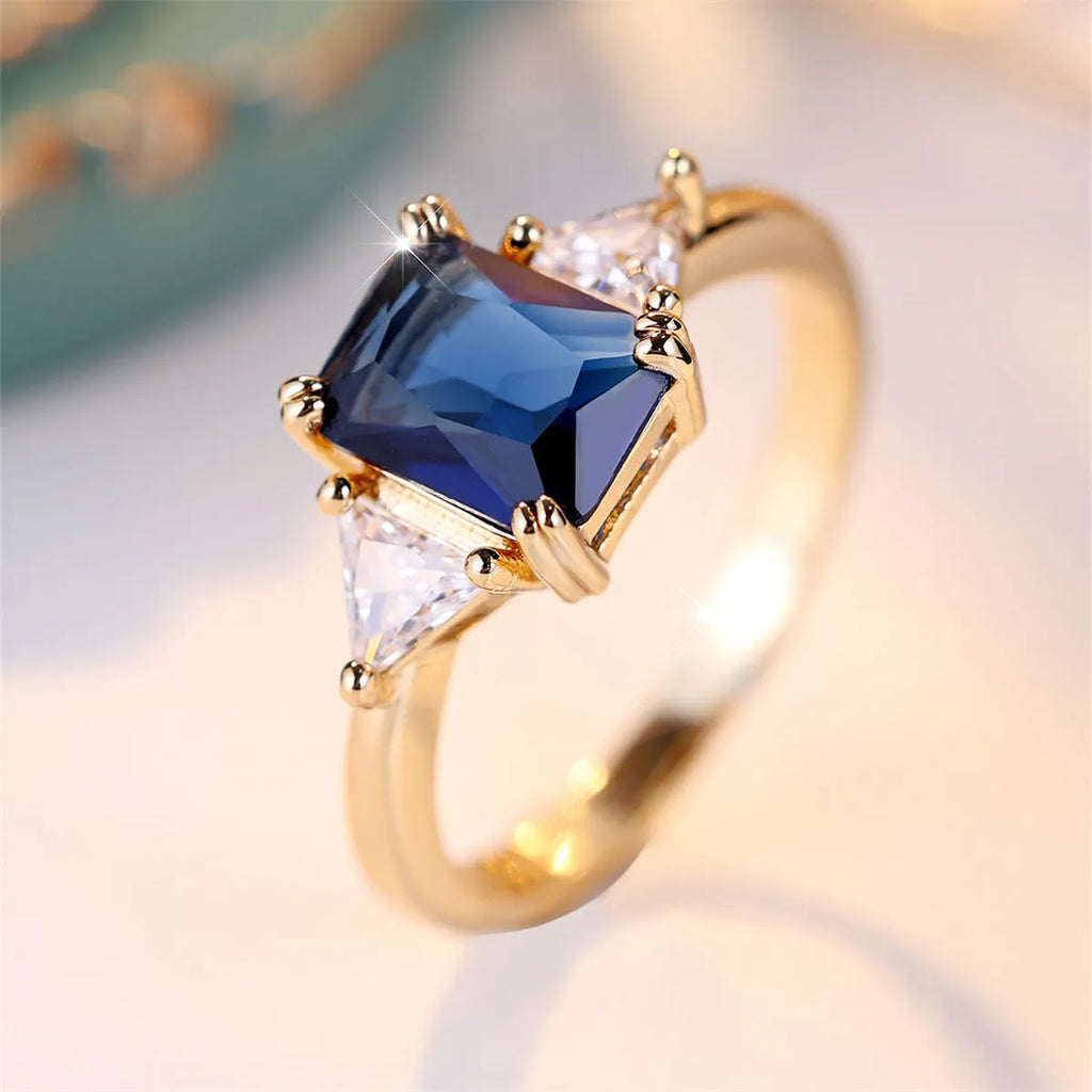 Gold sapphire blue rectangular copper ring for women showing geometric shape and metallic finish