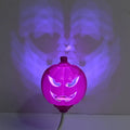Pumpkin-shaped lamp with USB charging, 22cm tall, emitting yellow or purple light for holiday decor