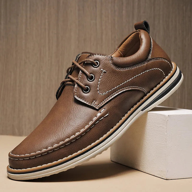 Men's brown genuine leather casual shoes with round toe and lace-up front on rubber sole