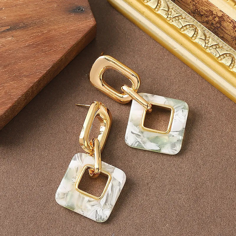 Hollow geometric square earrings with chamfered corners in electroplated copper