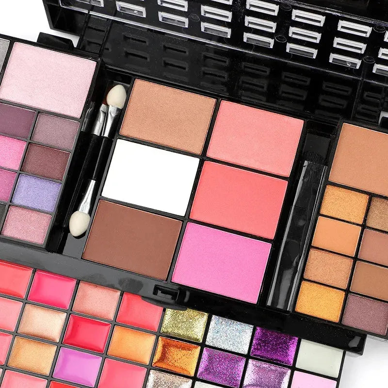 74-colour makeup set with 4-layer compact, eyeshadows, lip glosses, and brushes on display