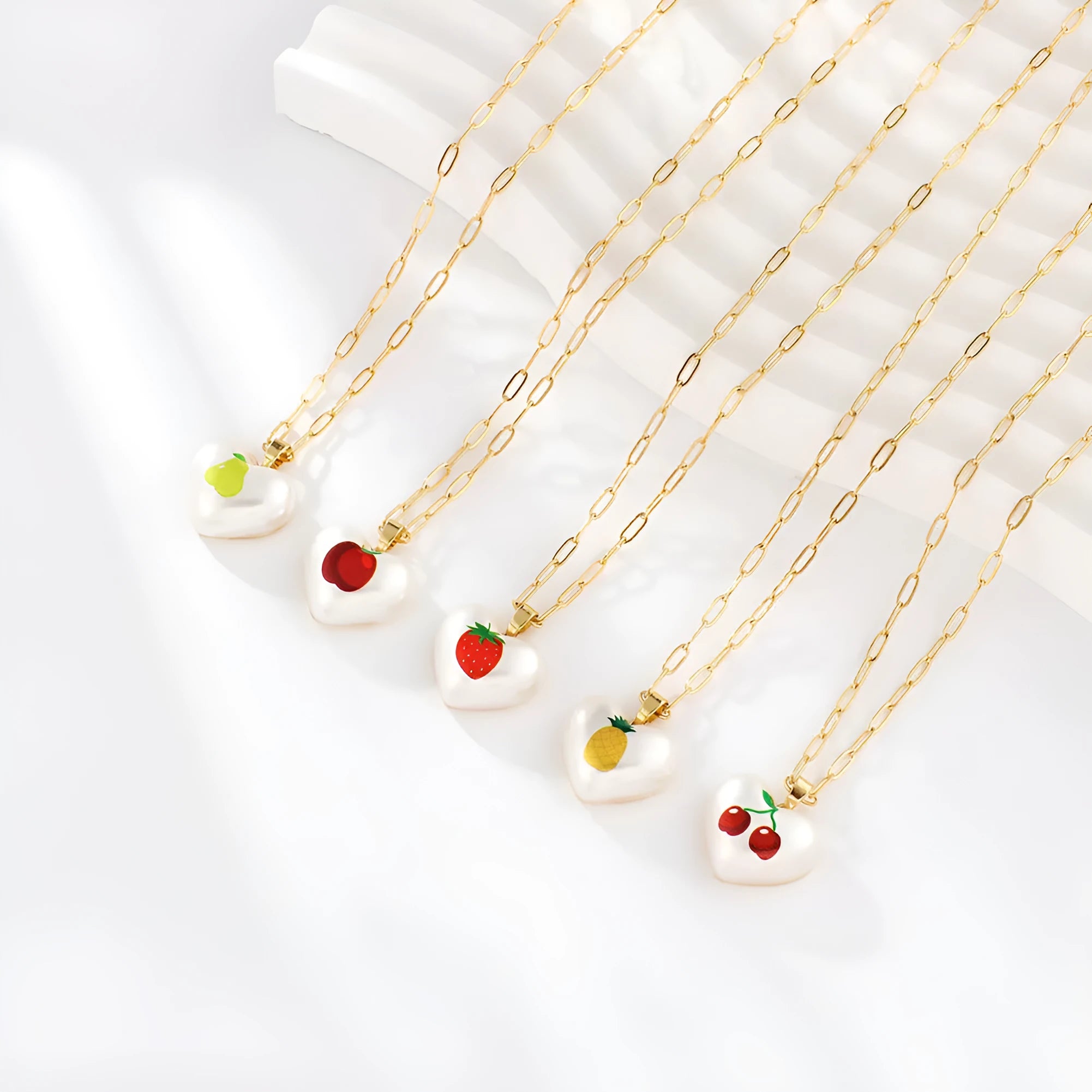 Fresh style geometric necklace with choice of apple, pineapple, strawberry, cherry, and pear fruit pendants on an adjustable chain.