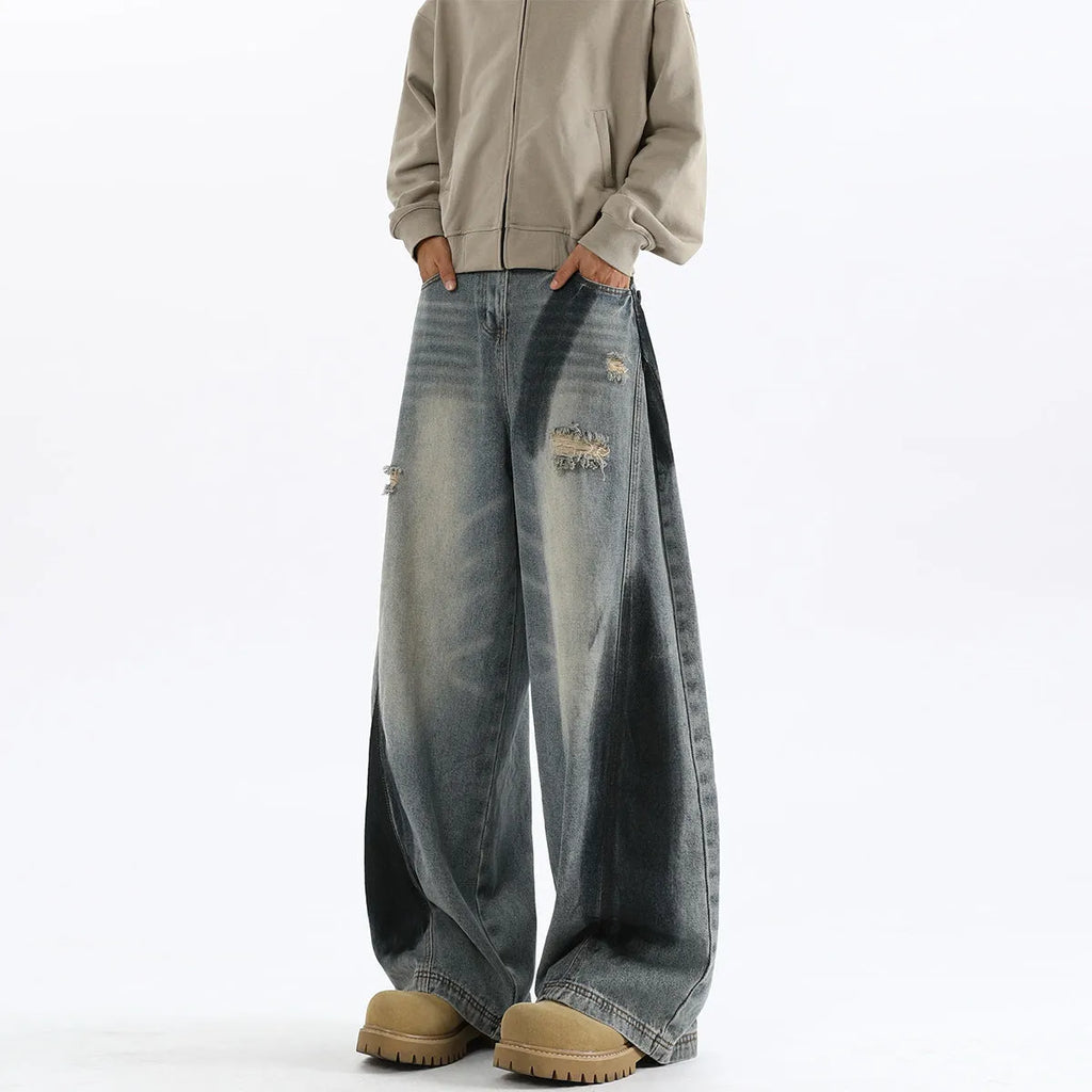 Men's blue loose fit ripped jeans with American-style splash-ink wash and distressed detailing