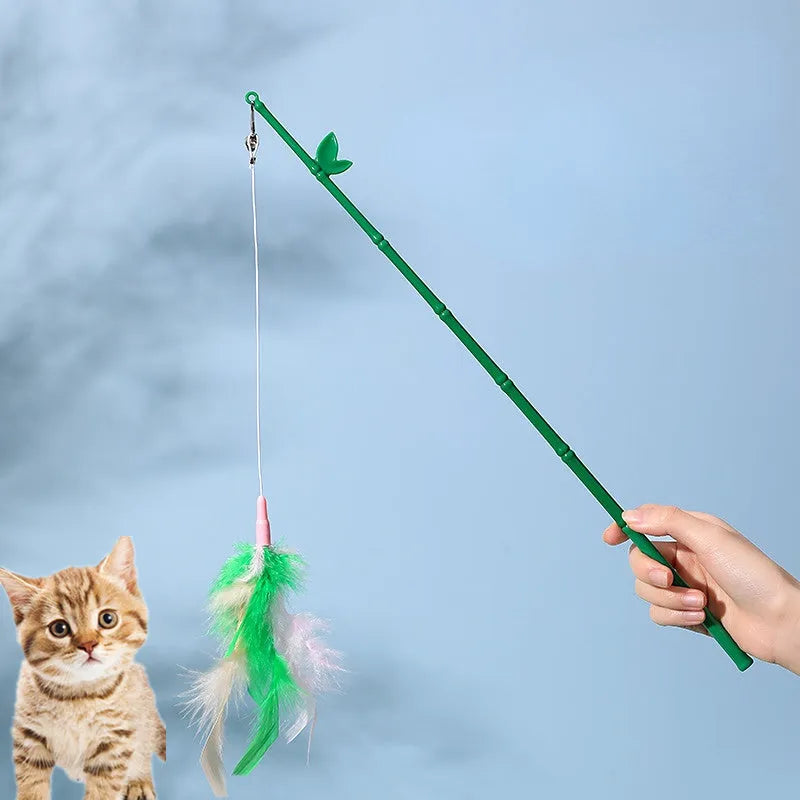 Green interactive cat wand toy with feather and bell attachments for stimulating play