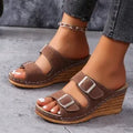Women's wedge sole beach slippers with decorative outer buckle in creamy-white colour