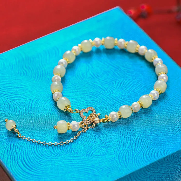 Women's Hetian jade bracelet with round pearl pendant in gold electroplated finish