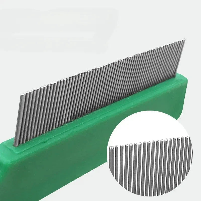 Green pet flea comb with stainless steel pins and plastic handle for grooming dogs and cats