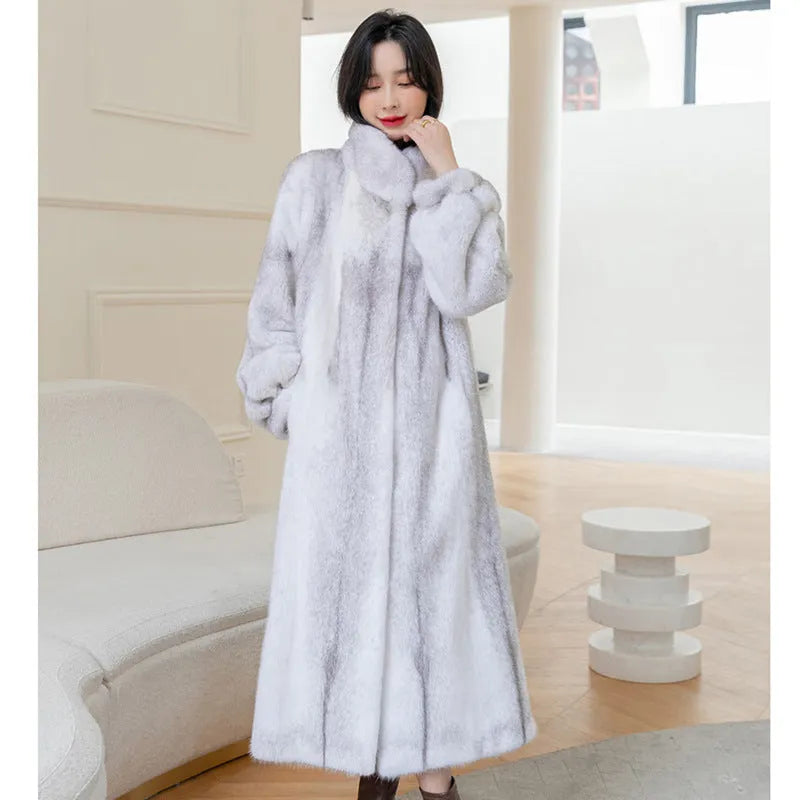 White women's faux fur coat with a stand-up collar, shown full-length.