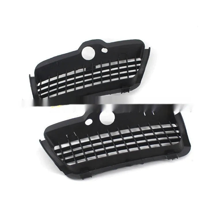 Pair of black ABS plastic Volkswagen Golf 3 front bumper fog light covers.
