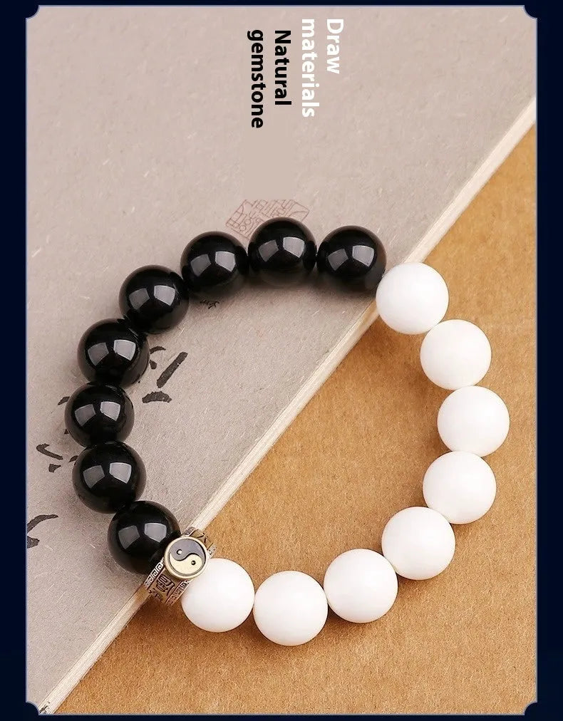 Black and white obsidian bracelet with taiji symbol and geometric beads