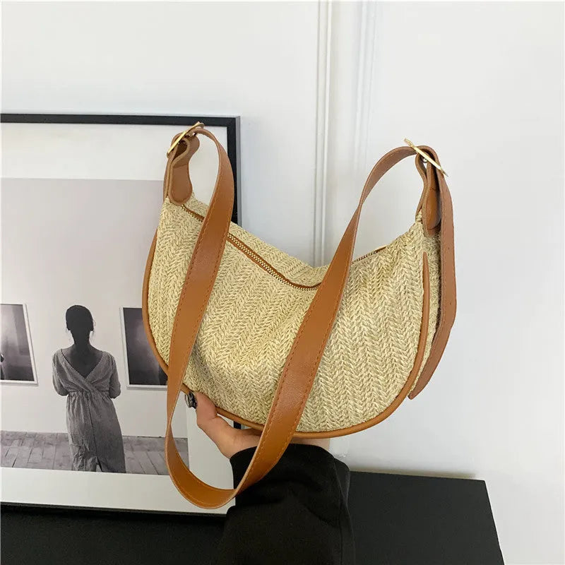 Women's woven straw crossbody bag showing internal phone and file compartments in corrugated brown colour