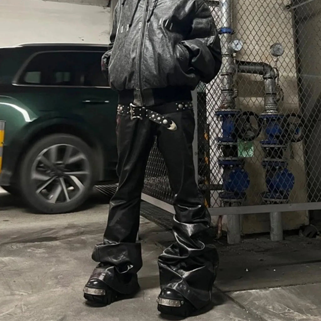 Black coated shiny patent leather skinny jeans with mid-waist straight-leg cut on a model