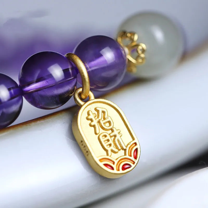 Amethyst purple geometric crystal bead bracelet ornament on a wrist.