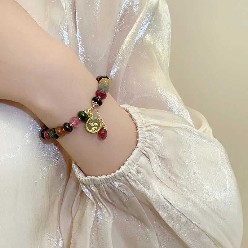 Colourful tourmaline abacus bead bracelet with rabbit pendant on natural stone beads
