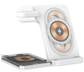 Black foldable wireless charging stand showing phone on magnetic arm, Apple Watch on charger, and earbuds on base.