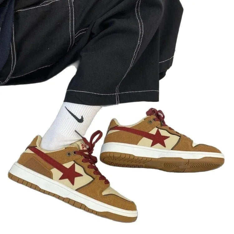 Brown low-top women's platform sneakers with sequin details and lace-up front.