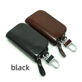 Black or brown genuine leather car key case with zipper, showing soft cowhide texture and internal size of 9.5cm by 4.5cm