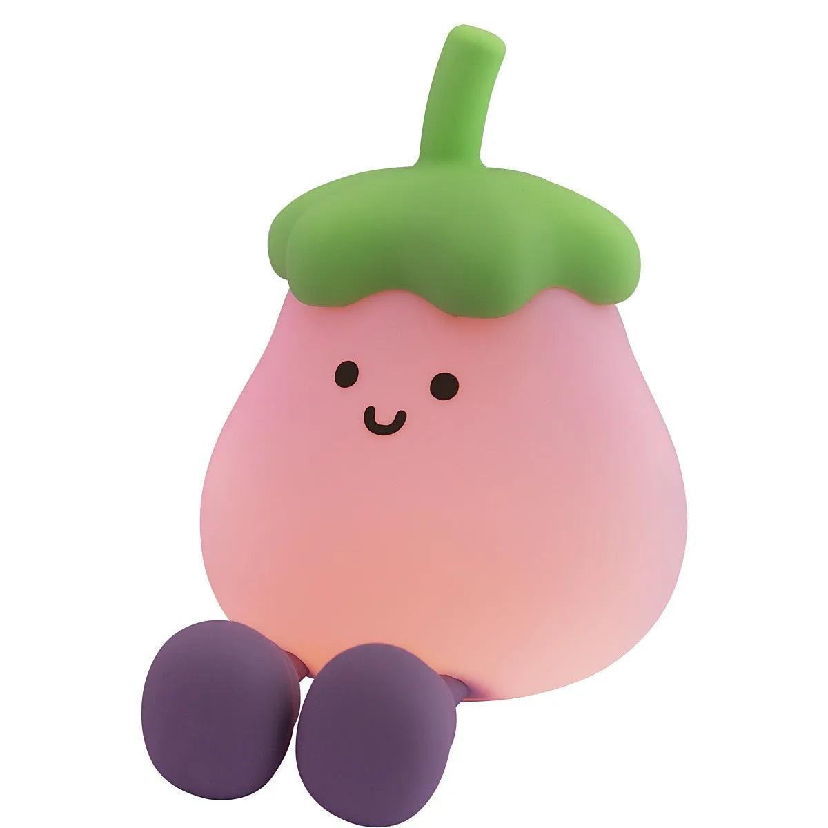 Cartoon-shaped eggplant night lamp glowing with soft yellow light on a table.