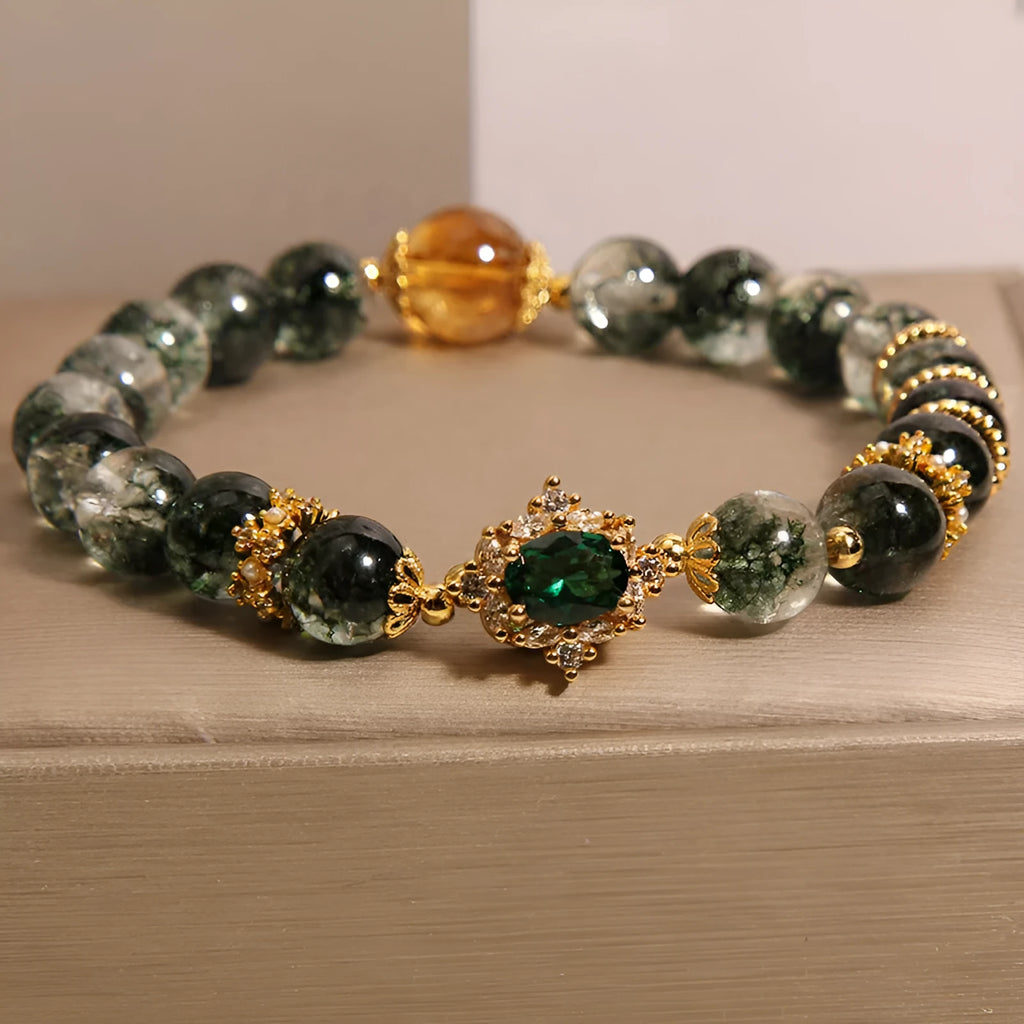 Women's gold rutilated quartz crystal bracelet with green phantom quartz beads and pearl rhinestone accents