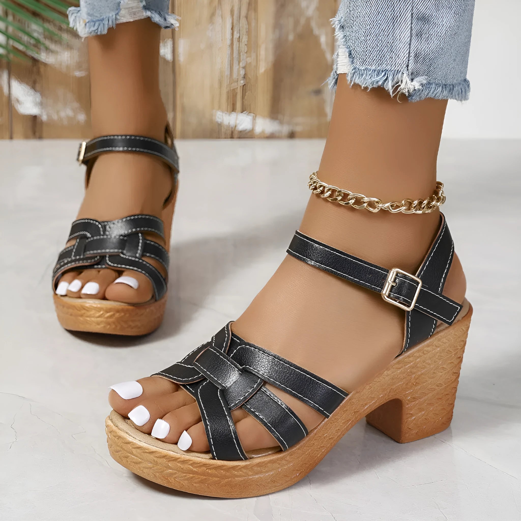 Plus size black Roman-style women's peep toe sandals with chunky heel and ankle-strap buckle.