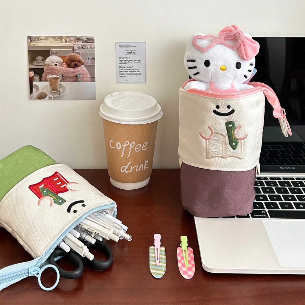 Brown collapsible pencil case with Korean-style cartoon design showing 17x14cm dimensions and Oxford fabric texture