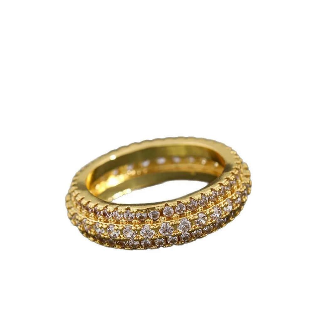 Geometric copper ring with triangle zircon inlay, shown in three metal colour options