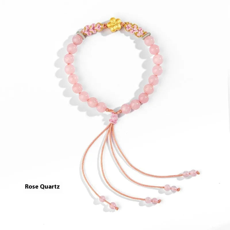 Chinese style hand-woven red rope bracelet with diamond crystal and peach blossom design in pink or red agate.