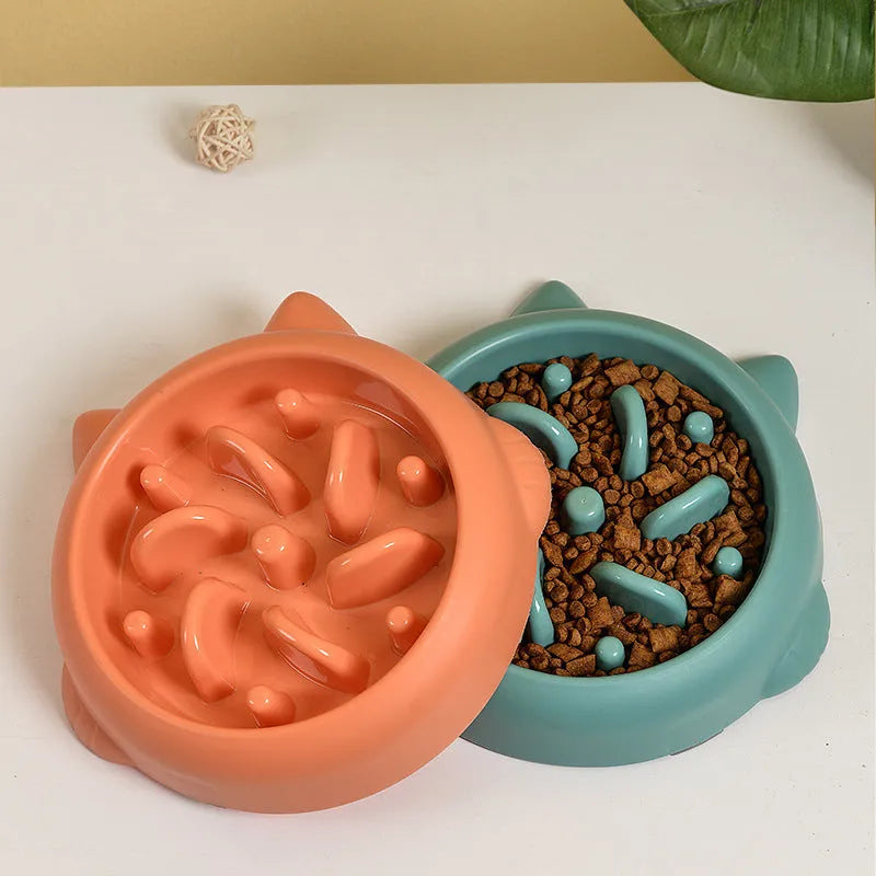 Green bone-shaped slow feeder dog bowl with raised ridges to prevent fast eating.