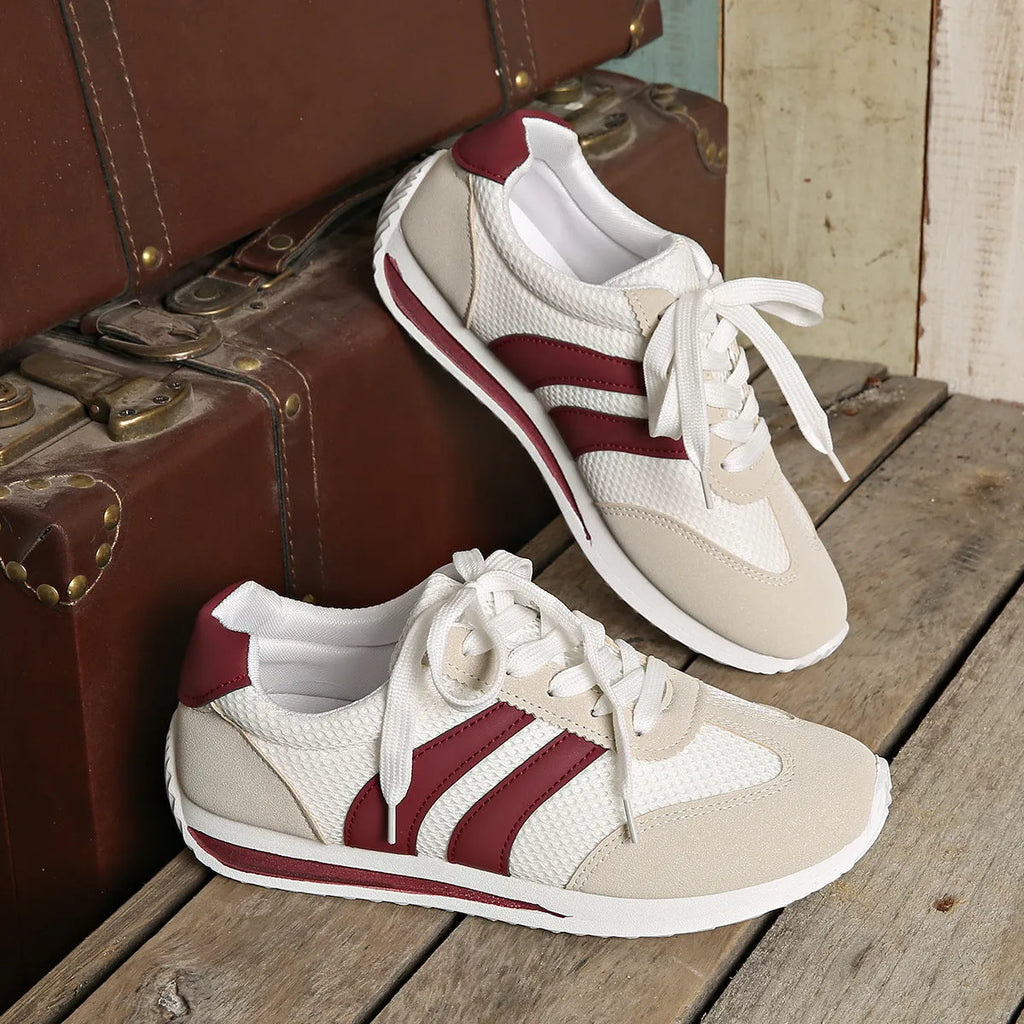 Wine red Cortez Retro low-top sneakers with cross-strap detail on synthetic leather upper.