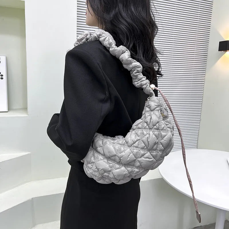 Women's nylon underarm bag in beige colour showing 35cm width and adjustable 120cm shoulder strap