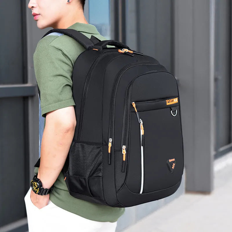 Men's large Oxford cloth schoolbag in red with air pillow belts and splicing detail.