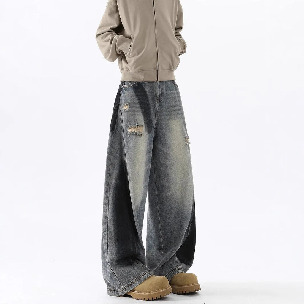 Men's blue loose fit ripped jeans with American-style splash-ink wash and distressed detailing