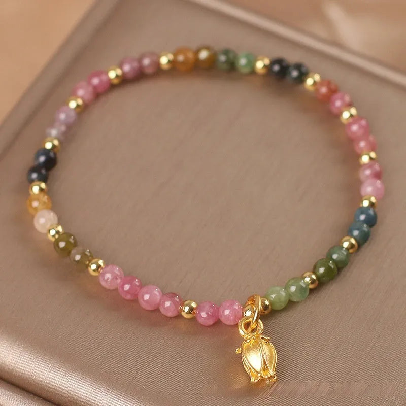 Natural tourmaline beaded adjustable anklet and bracelet set with floral charm detail