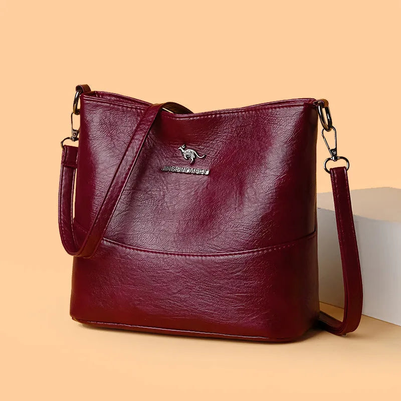 Women's bucket-shaped leather shoulder bag in minimalist style with large capacity