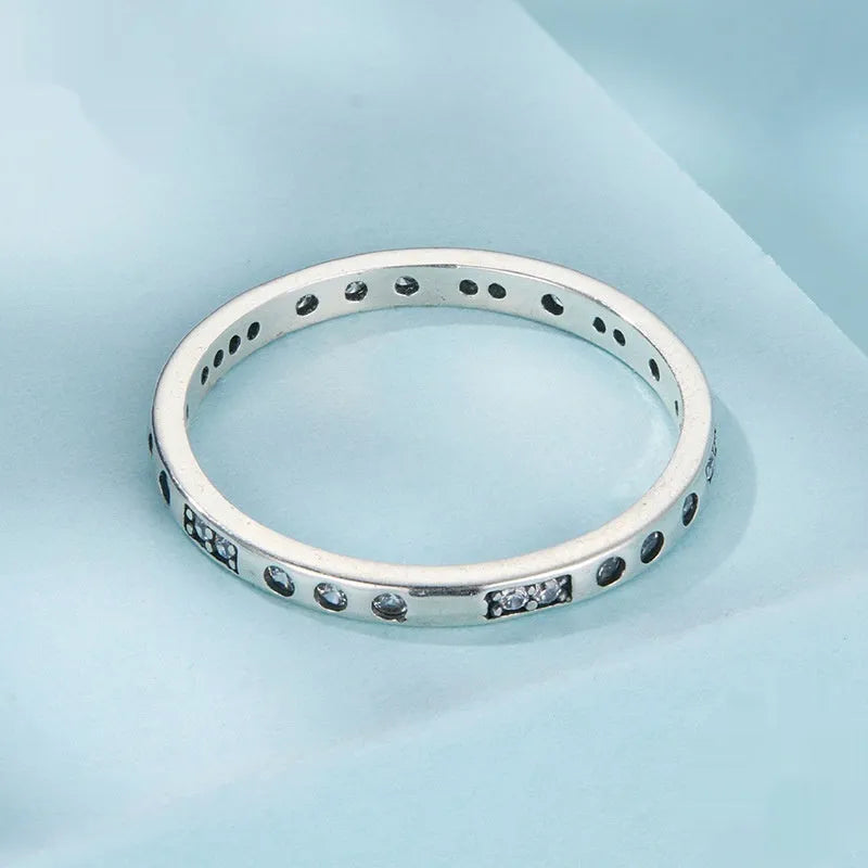 Silver Moss Password I Love You ring with oxidised black finish on a simple bracelet band.