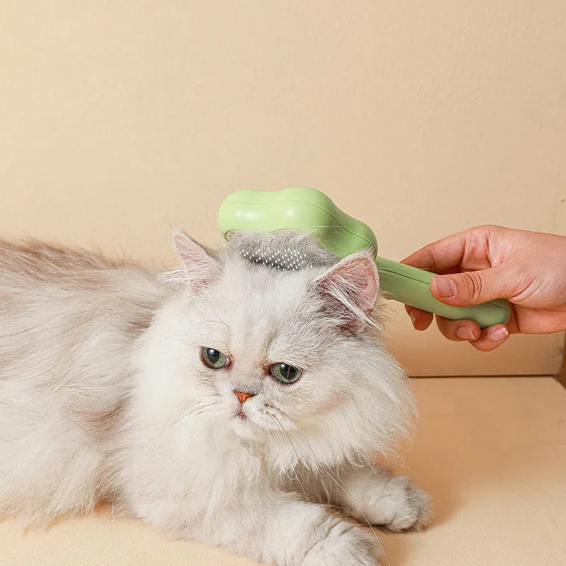 Green cat grooming comb with stainless steel needles and self-cleaning feature, 20cm length