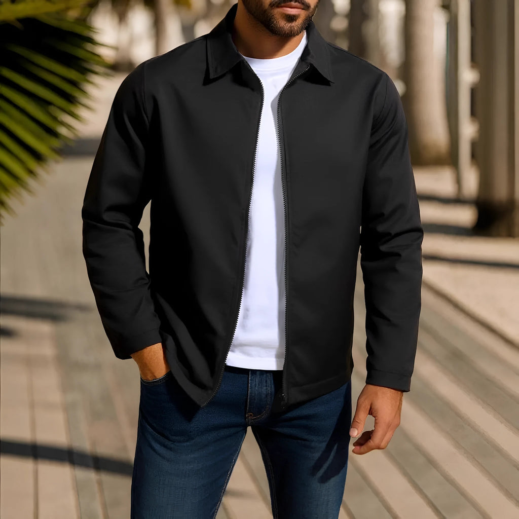 Man wearing an emerald green zippered cardigan jacket with raglan sleeves.