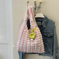 Soft square polyester shoulder bag with pleated bubble texture and an optional pendant, shown in multiple colours.