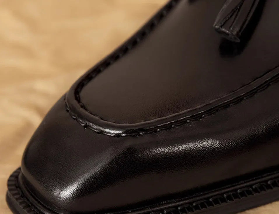 Men's black genuine leather fringed slip-on loafers with rubber soles and British styling