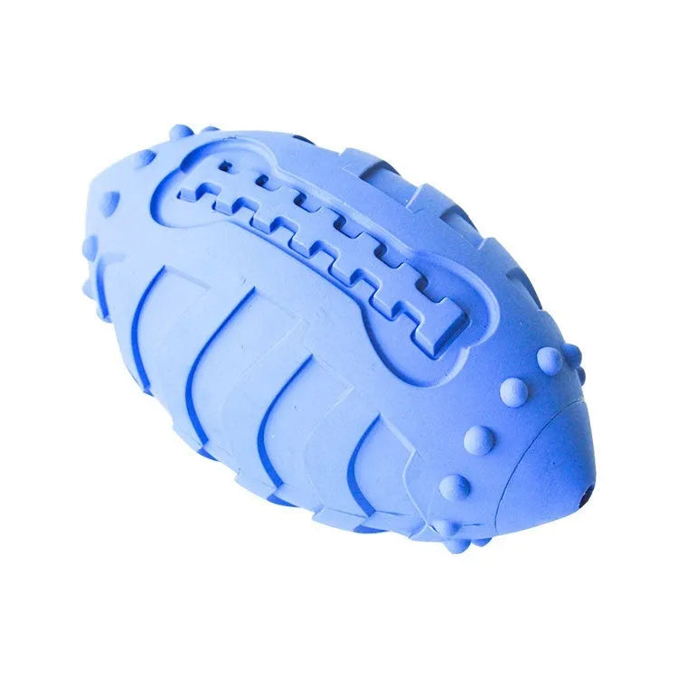 Light green rubber rugby ball dog toy with bite-resistant texture for interactive play and teeth cleaning.