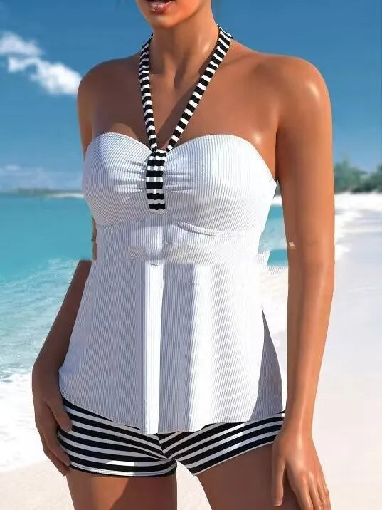 Women's black and white striped off-shoulder swimsuit on a mannequin.