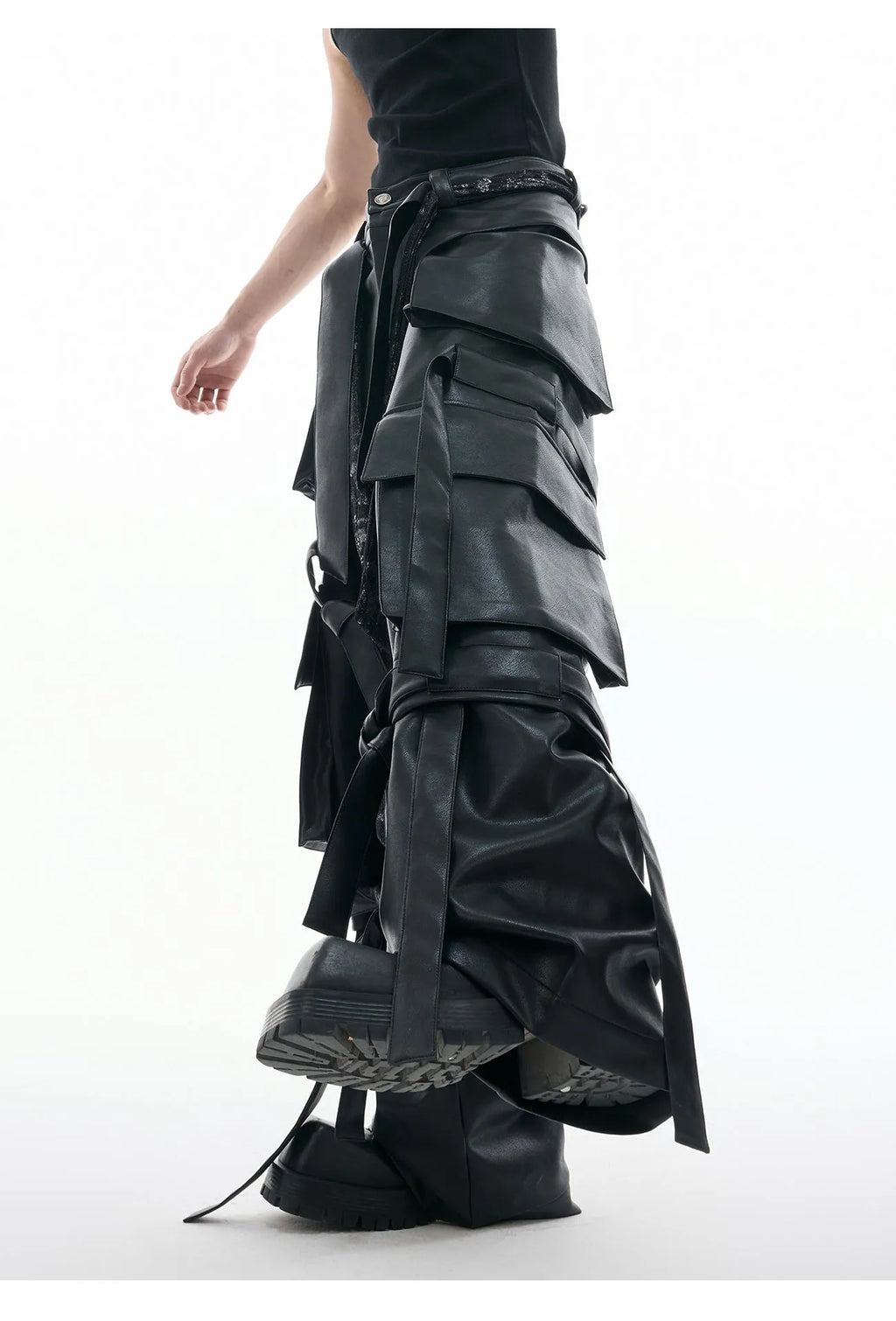 Black loose-fit quilted trousers with PU leather ribbon stitching and multiple pockets