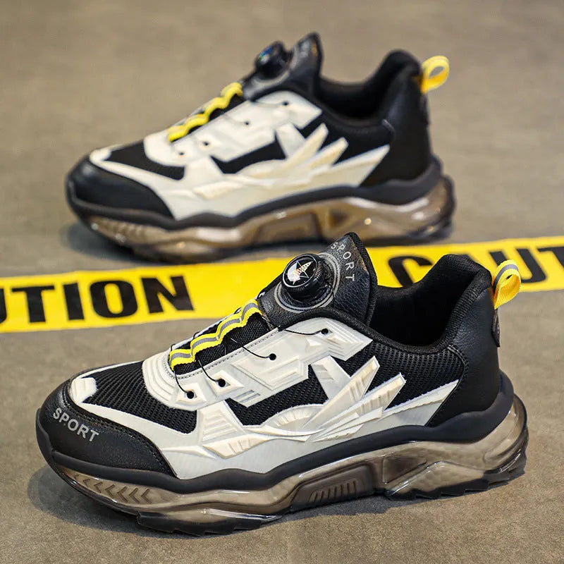 Men's black rotating button dad shoes with mesh upper and non-slip sole on wooden surface