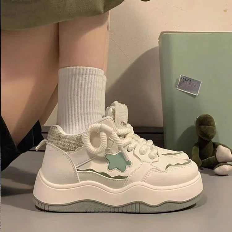 Women's green and pink artificial PU platform sneaker with front lace-up and round toe.